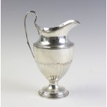 A silver ewer by Thomas Bradbury & Sons Ltd, Sheffield 1922, of tapering form on stepped circular