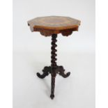 A mid 19th century rosewood pedestal lamp table, the octagonal top inlaid with burr thuya and raised