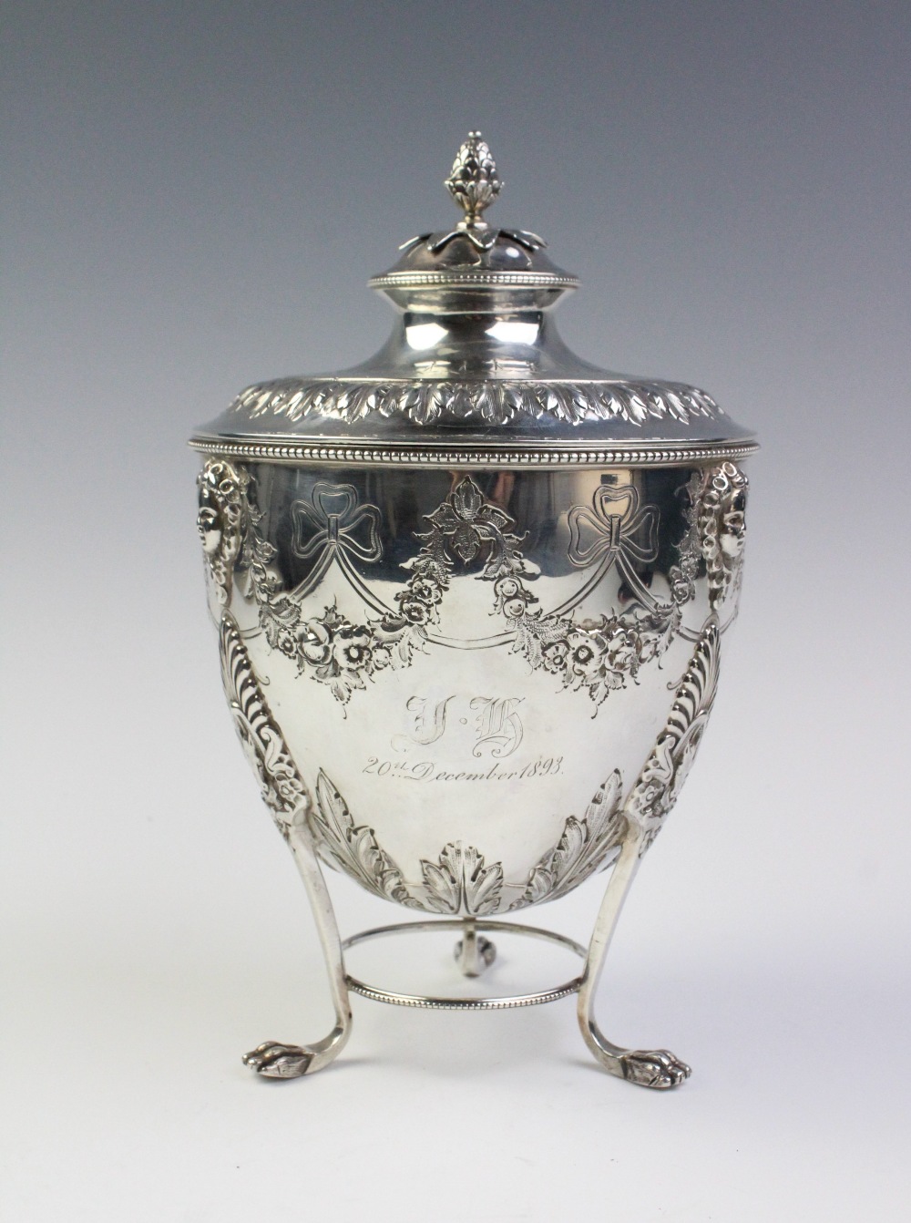 A late Victorian silver caddy by Martin, Hall & Co, Sheffield 1893, the urn shaped body resting on