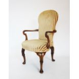 A George II style open mahogany armchair, late 19th/early 20th century, with an upholstered backrest