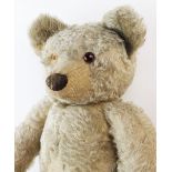 A Chad Valley growler bear of large proportions, circa 1930s, the blonde mohair bear with vertically