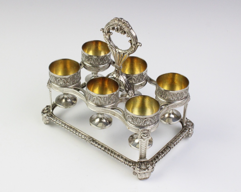 A George III silver egg cruet by Phillip Rundell, London 1819, the rectangular stand with