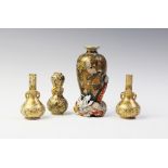 A Japanese Satsuma garniature of three vases, Meiji period (1868-1912), signed Gyokusen, each of
