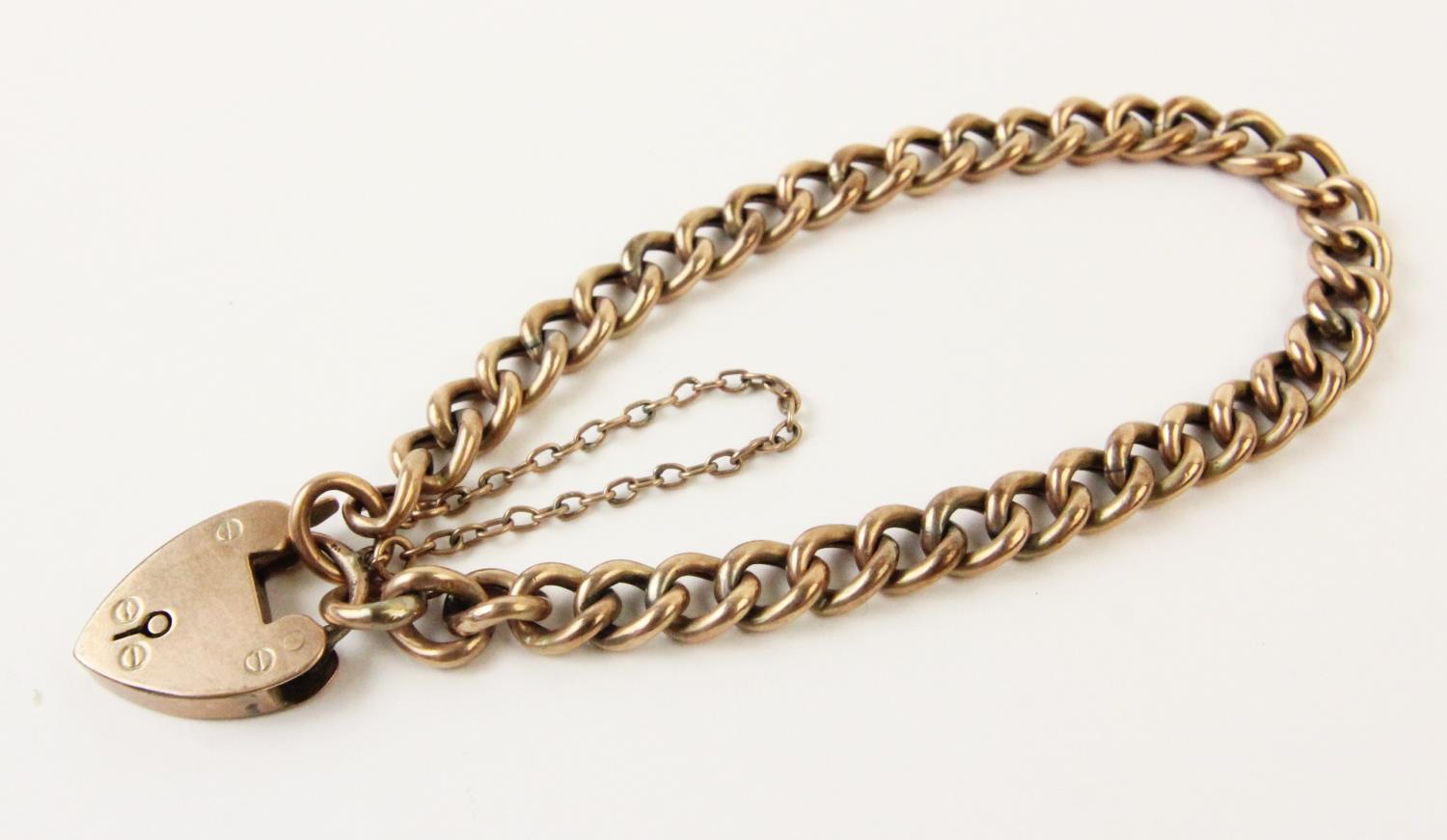 A curb-link bracelet, each hollow link stamped '9C', 18cm long, suspending a 9ct gold heart-shaped