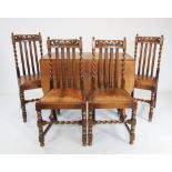 A set of six 17th century revival oak dining chairs, circa 1920, each with a carved open work