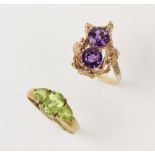 A 9ct gold amethyst set dress ring, comprising two round brilliant cut purple amethysts, each 7mm