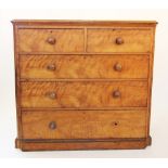 A Victorian satin birch chest of drawers, the rectangular moulded top with rounded front corners,