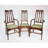 Three early 20th century oak Arts and Crafts chairs, each with an angular tapering back with three