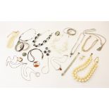 An assortment of vintage and modern costume jewellery, to include a silver engraved bangle with