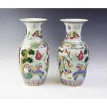 A pair of Chinese porcelain famille rose vases, 20th century, each of baluster form and