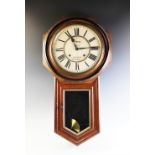 A late 19th century American walnut cased wall clock by Ansonia Clock Co., the dial signed J