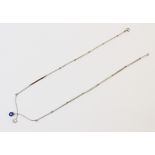 A diamond and sapphire 18ct white gold necklace, comprising a round old cut diamond weighing approx.