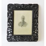 A carved wooden photograph frame, early 20th century, the tropical hardwood frame