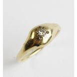 A diamond set 18ct gold ring, comprising a small old cut diamond claw set in yellow gold to a