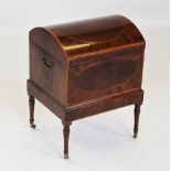 A George III domed mahogany cellarette, the satinwood cross banded hinged cover enclosing a