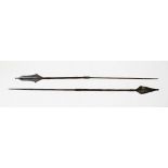 Two Congolese Mbole spears, 19th century, each with metal shaft, leather grips and decorated