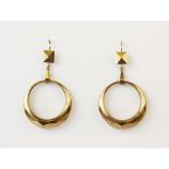A pair of 9ct gold drop earrings, each comprising a faceted hoop dropper suspended on shepherds hook