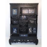 A Japanese carved wood shibayama inlaid display cabinet, Meiji period, designed as an arrangement of