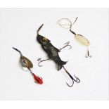 Three late 19th century/early 20th century fishing lures, including a white metal fish shaped