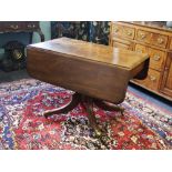 A 19th century mahogany pedestal Pembroke table, the rectangular thumb moulded drop leaf top,