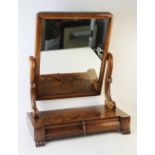A Victorian mahogany dressing table mirror, the rectangular tilting mirror raised upon 'S' shaped
