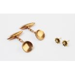 A pair of 9ct gold cufflinks, each of circular form with a torpedo shaped bar attached, 25mm long,
