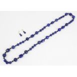 A single strand lapis lazuli bead necklace, comprising spherical and tumble polished beads of