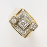 A gent's diamond set geometric cluster ring, the tiered cluster comprising a central round brilliant