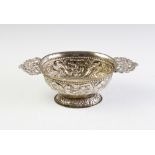 A Dutch silver brandy bowl, of oval form with cast pierced handles on domed foot, elaborately