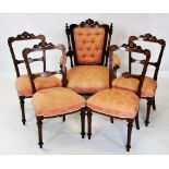 An Edwardian inlaid walnut parlour suite, the open armchair with a carved leaf swept crest above a