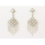 A pair of diamond and pearl drop earrings, each diamond shaped surmount set with a round cultured