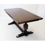 A 17th century style oak refectory table, early 20th century, the rectangular draw leaf top