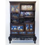 A Japanese carved wood shibayama inlaid display cabinet, Meiji period, designed as an arrangement of