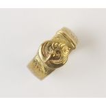 A 9ct gold buckle design ring, with scrolling engraved detail, ring size S 1/2, weight 7.6gms