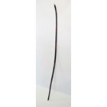 A Japanese Edo/Meiji period long bow (Yumi), of traditional form with red and black lacquer binding,