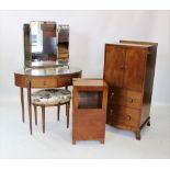 A mid 20th century four piece bedroom suite, comprising an oval dressing table with triple mirror