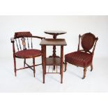 An Edwardian mahogany corner chair, with an inlaid pierced splat above an oval padded seat, raised