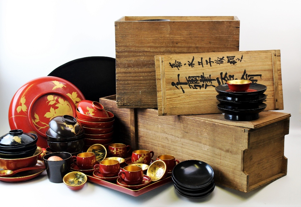 A collection of Japanese lacquered tea wares, 20th century, to include; a set of twelve red