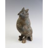 A Chinese bronze Hu modelled as an owl, of archaic form, moulded in relief, with detachable head,