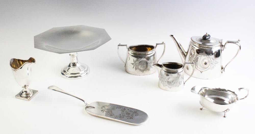 A selection of white metal table wares, to include, a George III style sauce boat by Adie