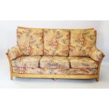 An Ercol blonde ash 'Renaissance' three piece lounge suite, comprising a three seater settee with