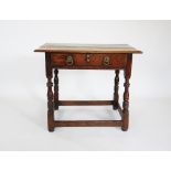 An 18th century honey oak side table, the rectangular thumb moulded top with rounded front