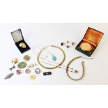 An assortment of costume jewellery, to include, a gold plated bangle by Excalibur, a gold plated