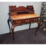A Louis XV style ladies walnut writing desk, 20th century, the waterfall shaped raised back with