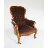A Victorian mahogany show frame button back drawing room chair, the spoon back with a mahogany frame