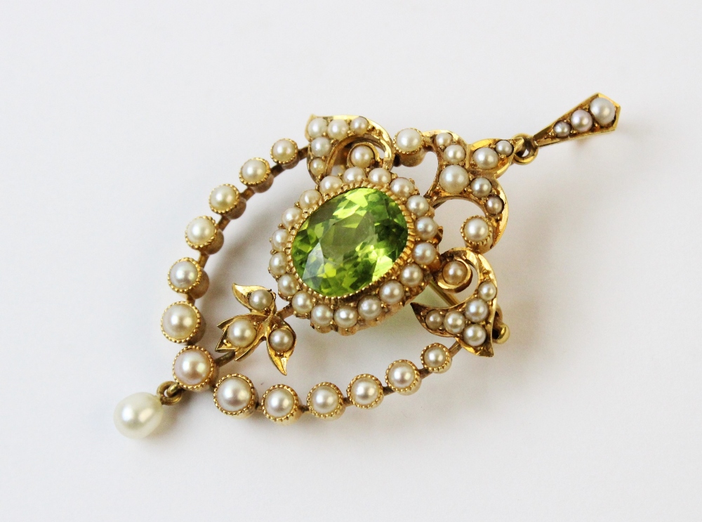 An Edwardian style peridot and seed pearl pendant/brooch, the central oval mixed cut peridot - Image 3 of 3