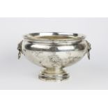 A silver punch bowl by Edward Barnard & Sons Ltd, London 1935, of circular form on pedestal foot