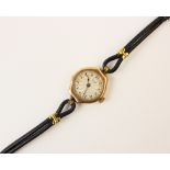 A lady's vintage 9ct gold Rolex wristwatch, the round cream dial with engine turned decoration and