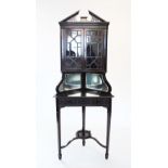 An Edwardian Chinese Chippendale revival freestanding corner display cabinet, with an openwork