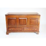 A George III oak and mahogany cross banded mule chest, the rectangular moulded top above three